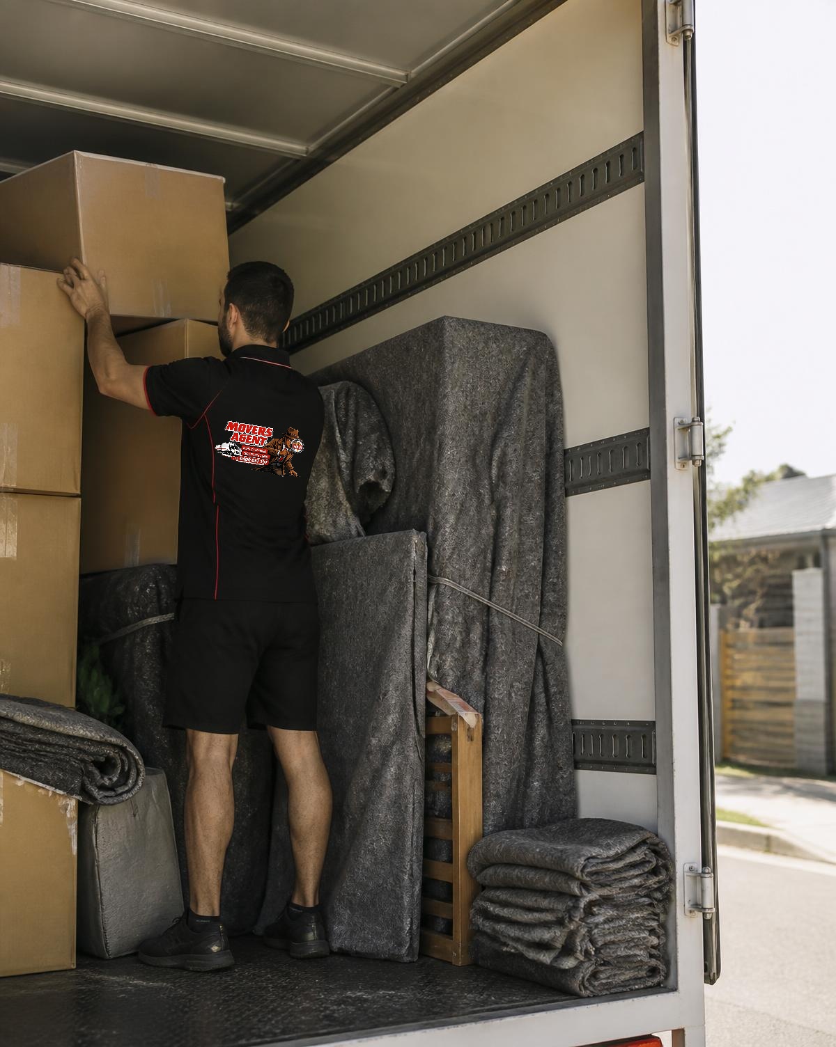 Removal crew loading furniture into a moving truck